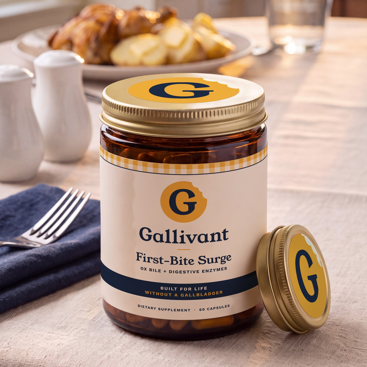 Gallivant First-Bite Surge on a dinner table next to a plate of roast chicken